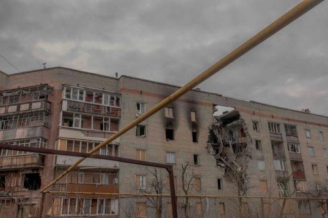 This photograph taken on February 1, 2025 shows a residential building heavily damaged by shelling in Lyman, Donetsk region, amid the Russian invasion of Ukraine. - Roman PILIPEY / AFP