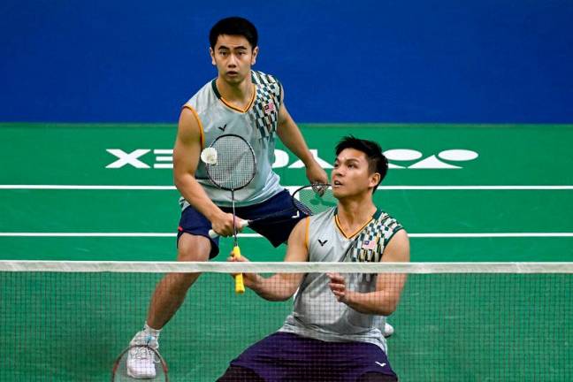 Malaysia’s top men’s doubles pair, Nur Izzuddin (R) and Goh Sze Fei. - Sajjad HUSSAIN / AFP