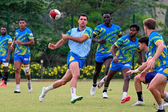 Hyderabad Heroes' Spanish player Manuel Moreno (3L) takes part in a training session at the Cidco football ground in Kharghar, Navi Mumbai on June 7, 2025, ahead of Indian Rugby Premier League. India launches a rugby sevens league this weekend in a bold bid to win fans and bolster dreams of the Olympics in a country where cricket is king. The 34-match Rugby Premier League (RPL) will be staged for two weeks from June 15 in Mumbai and has attracted greats of the game such as the United States' try-scoring machine Perry Baker. - Punit PARANJPE / AFP