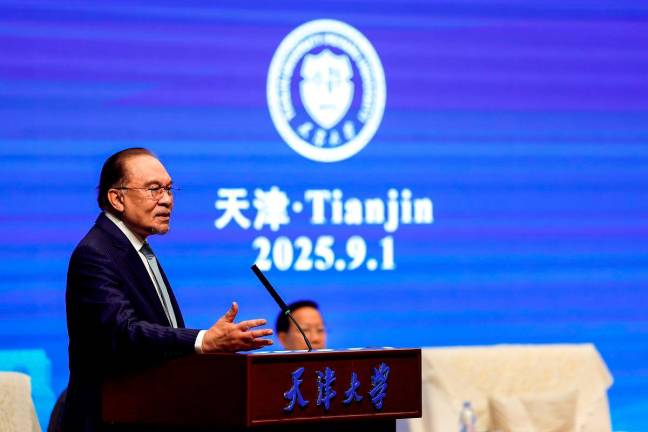 Prime Minister Datuk Seri Anwar Ibrahim delivers a public lecture entitled ‘Sovereign Interdependence: Building a Shared Future in Asia’ at Tianjin University, the oldest modern university in China today. - Bernama pic