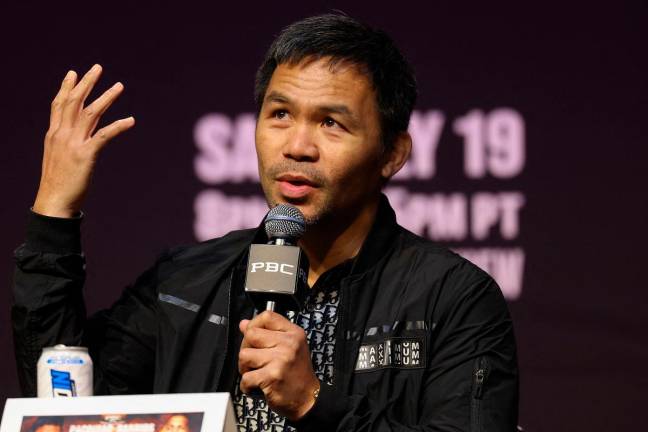 Filipino boxer Manny Pacquiao speaks during the press conference ahead of his July 19 WBC welterweight title fight against Mexican-US boxer Mario Barrios at the NOVO at L.A. Live in Los Angeles on June 3, 2025. - Patrick T. Fallon / AFP