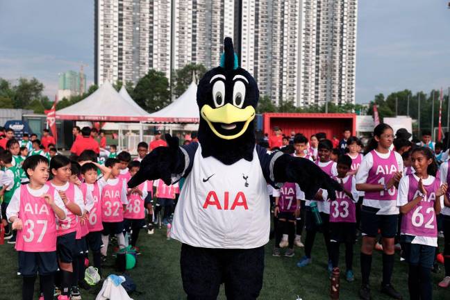 Chirpy Cockerel, the mascot of Tottenham Hotspur Football Club cheering the participants.