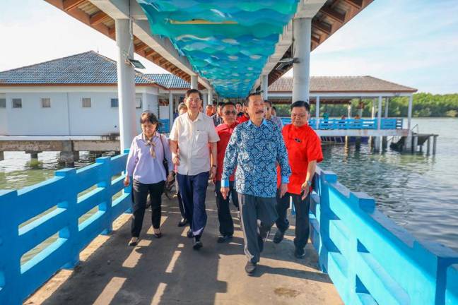 Tan arriving at Pulau Ketam on Friday. – AMIRUL SYAFIQ/THESUN