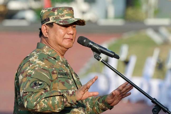 This handout picture taken and released on October 25, 2024 by the official Media Partner of the Gerindra Party shows Indonesia's President Prabowo Subianto speaking during a visit to the military academy in Magelang, Central Java. - AFP PHOTO / Media Partner of Gerindra Party