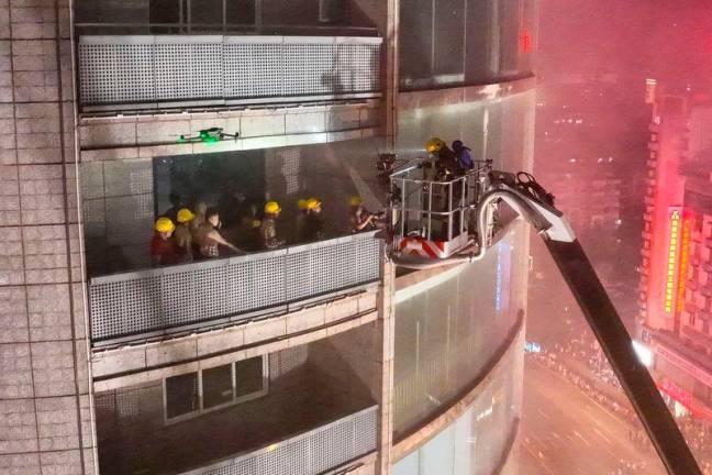Firefighters extinguish a fire tearing through a shopping centre in Zigong in China’s southwestern Sichuan province on July 17, 2024/AFPpix