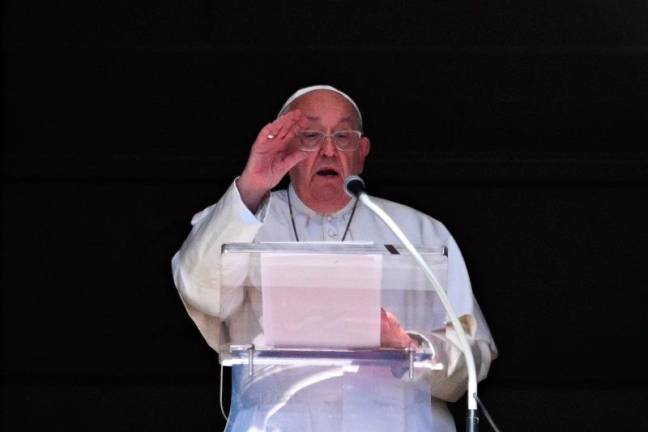 Pope Francis delivers his speech from the window of the Apostolic Palace overlooking St. Peter’s Square during the weekly Angelus prayer, in the Vatican on October 13, 2024. - Andreas SOLARO / AFP