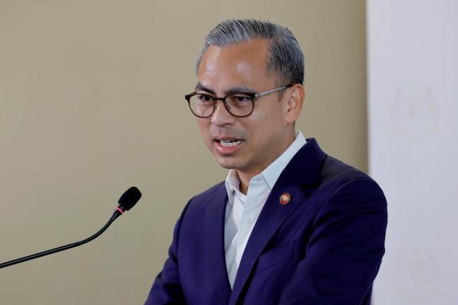 Communications Minister Datuk Fahmi Fadzil speaking during a press conference after the weekly Cabinet meeting today. - Bernama pic