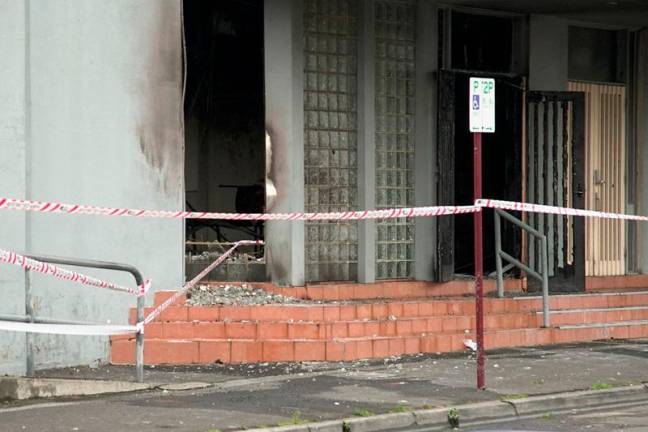 This photo shows a general view of the fire damage at the cordoned off Adass Israel Synagogue in Melbourne on December 6, 2024. Mask-wearing arsonists set a synagogue ablaze in a pre-dawn attack on December 6 in the Australian city of Melbourne, police said, sparking widespread condemnation. - Tania LEE / AFP