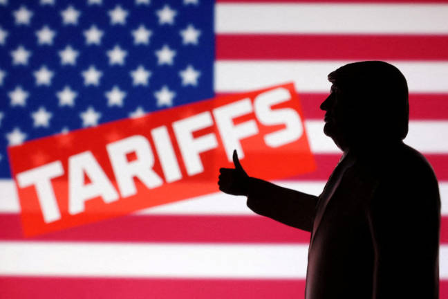 A 3D-printed miniature model depicting U.S. President Donald Trump, the U.S. flag and the word “Tariffs” in this illustration, April 17, 2025. - REUTERSpix