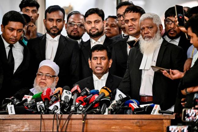 Chief prosecutor of Bangladesh's International Crimes Tribunal (ICT) Mohammad Tajul Islam (C) speaks during a press conference outside the ICT court in Dhaka on June 1, 2025, after the start of the trial against Bangladesh’s former Prime Minister Sheikh Hasina. - Munir UZ ZAMAN / AFP