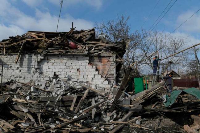 For representational purpose - Specialists repair a gas pipeline by a destroyed house following recent shelling, which local Russian-installed officials called a Ukrainian military strike, on the outskirts of Yenakieve in the Donetsk region, Russian-controlled Ukraine, on March 5, 2025, amid the ongoing Russian-Ukrainian conflict. AFPpix