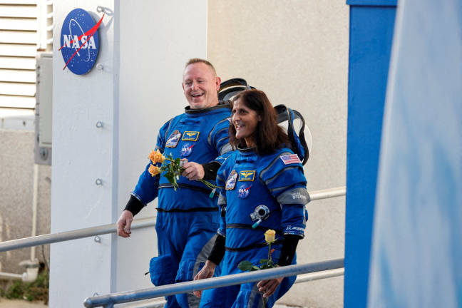 NASA astronauts Butch Wilmore and Suni Williams walk at NASA’s Kennedy Space Center, ahead of Boeing’s Starliner-1 Crew Flight Test (CFT) mission on a United Launch Alliance Atlas V rocket to the International Space Station, in Cape Canaveral, Florida, U.S., June 5, 2024. - REUTERSpix