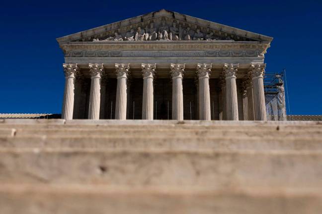 (FILES) The US Supreme Court is seen in Washington, DC, March 2, 2025. The US Supreme Court allowed the Trump administration on May 19, 2025 to end legal protections that have shielded some 350,000 Venezuelans from potential deportation. The court granted a request by Homeland Security Secretary Kristi Noem to revoke temporary protected status (TPS) for the Venezuelans while an appeal proceeds in a lower court. - Tierney L CROSS / GETTY IMAGES NORTH AMERICA / AFP