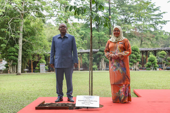 President of Guinea-Bissau Umaro Sissoco Embalo marks his visit to the Perdana Botanical Garden in Kuala Lumpur by planting a Merbau tree today. - BERNAMApix