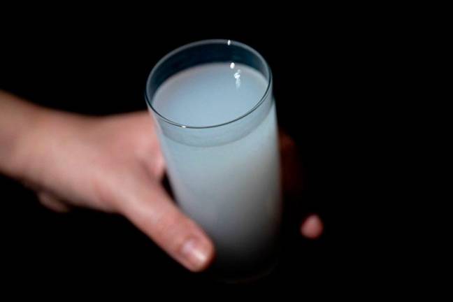 This illustration photograph shows a glass of a traditional alcoholic drink “Raki”, in Istanbul, on January 16, 2025.