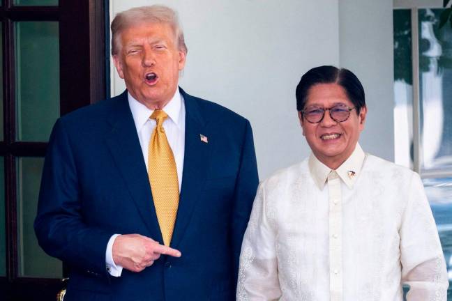 US President Donald Trump welcomes Filipino President Ferdinand Marcos Jr. at the entrance to the West Wing of the White House - AFPPix