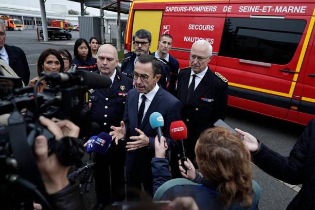 France's Minister of the Interior Bruno Retailleau speaks with the media during his visit at the Fire and Rescue centre in Chessy, east of Paris on October 31, 2024. - STEPHANE DE SAKUTIN / AFP