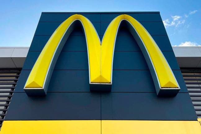 A McDonald’s emblem adorns the front of one of their outlets in Sydney on July 4, 2024. McDonald’s fast-food outlets in Australia have cut breakfast service hours as bird flu outbreaks around the country hit egg supplies. - AFPpix