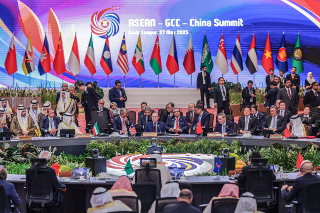 Prime Minister Anwar Ibrahim delivers his speech during the ASEAN-Gulf Cooperation Council (GCC)-China Summit at the Kuala Lumpur Convention Centre, today. Also present is Chinese Premier Li Qiang, alongside leaders and representatives from ASEAN, GCC member states, and China. – BERNAMApix