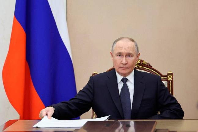 Russia’s President Vladimir Putin chairs a meeting with senior officials to discuss the upcoming peace talks with Ukraine in Moscow, Russia May 14, 2025. Sputnik/Alexander Kazakov/Pool via REUTERS