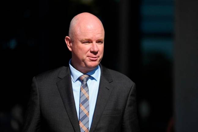 Simon Patterson leaves Latrobe Valley Magistrates’ Court where Erin Patterson attended her trial in Morwell on May 2, 2025. Erin Patterson, 50, is charged with three murders -- the parents and aunt of her estranged husband -- and one attempted murder. AFPpix