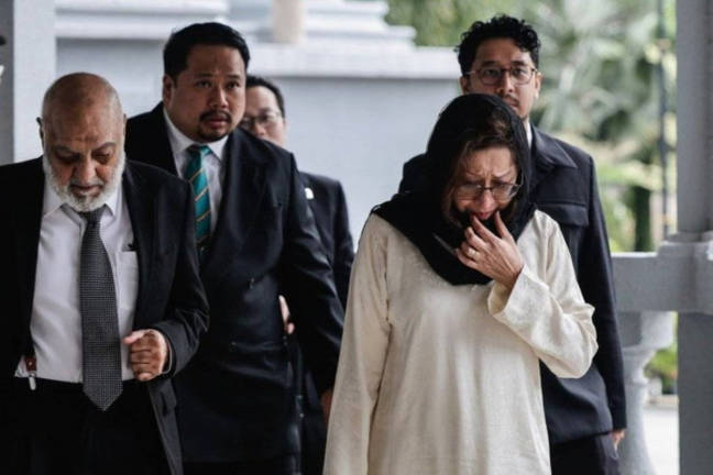 Toh Puan Na’imah Abdul Khalid (centre) was seen attending the mention of her late husband, Tun Daim Zainuddin’s case at the Kuala Lumpur Court Complex with her counsel, Datuk Dr Gurdial Singh Nijar.