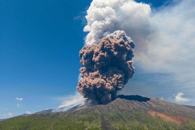 Smoke rises from the crater of the Etna volcano as it erupts, on Mount Etna near Catania on June 2, 2025. A huge plume of ash, gas and rock spewed forth on June 2, 2025, from Italy’s Mount Etna, Europe’s largest active volcano, after a portion of its southeastern crater likely collapsed, authorities said. - Giuseppe Distefano / AFP