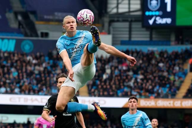 Manchester City’s striker Erling Haaland controls the ball during the English Premier League football match between Manchester City and Burnley at the Etihad Stadium in Manchester, north west England, on September 27, 2025. - AFP