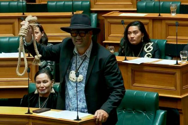 This screen grab taken from video released by the New Zealand Parliament on June 5, 2025 shows Maori Party co-leader Rawiri Waititi holding a noose while speaking at the parliament in Wellington. New Zealand's Parliament on June 5 handed record bans to three indigenous Maori lawmakers, including Rawiri Waititi, who last year staged a protest haka on the debating floor. - AFP PHOTO / NEW ZEALAND PARLIAMENT
