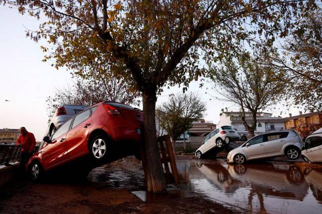 Cars are stacked one against another after floods in Utiel, Spain, October 30, 2024. - REUTERS/Susana Vera