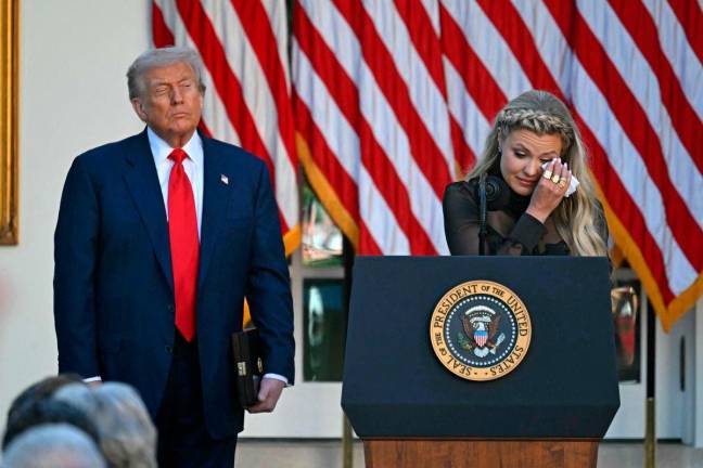 US President Donald Trump and Erika Kirk, Charlie Kirk’s widow, participate in a Medal of Freedom Ceremony for late US right-wing activist Charlie Kirk in the Rose Garden of the White House in Washington, DC. Photo by ANDREW CABALLERO-REYNOLDS / AFP