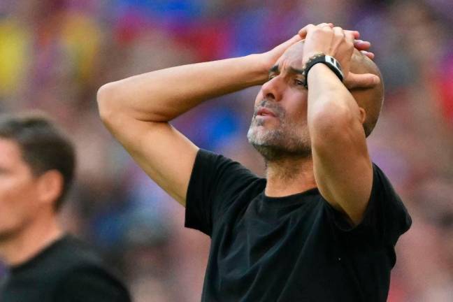 Pep Guardiola’s gestures on the touchline during the English FA Cup final football match between Crystal Palace and Manchester City at Wembley stadium - AFPpix