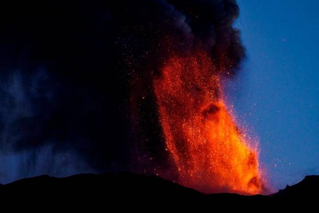 Lava and smoke rise from a crater of Mount Etna, Europe's most active volcano, Italy July 4, 2024. REUTERS/Etna Walk/Giuseppe Di Stefano TPX IMAGES OF THE DAY