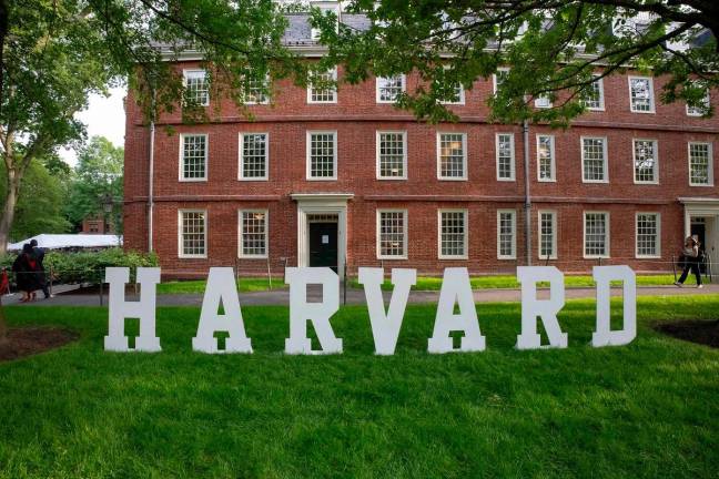 A Harvard sign is seen at the Harvard University campus in Boston, Massachusetts, on May 27, 2025. US President Donald Trump on June 4, 2025 announced a ban on visas for foreign students who are set to begin attending Harvard University, ramping up his administration’s crackdown on higher education. - Rick Friedman / AFP