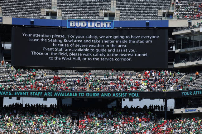 A screen displays a message to the fans as the match is suspended due to adverse weather at MetLife Stadium, East Rutherford, New Jersey, U.S. - June 19, 2025. - REUTERS
