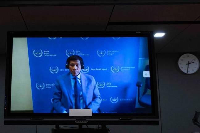 Former Philippine President Rodrigo Duterte is seen on a screen in the courtroom during his first appearance before the International Criminal Court (ICC) on charge of crimes against humanity over his deadly crackdown on narcotics in The Hague. AFPpix