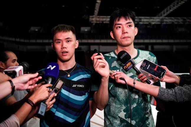 National men’s doubles player, Man Wei Chong (R) and Tee Kai Wun (L). - BERNAMApix