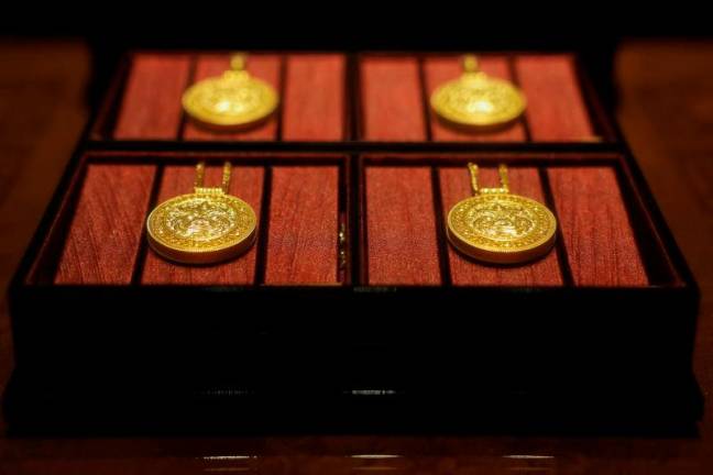 Gold necklaces sit in a display case at a Laopu Gold jewellery store in Beijing, China March 12, 2025. REUTERSpix