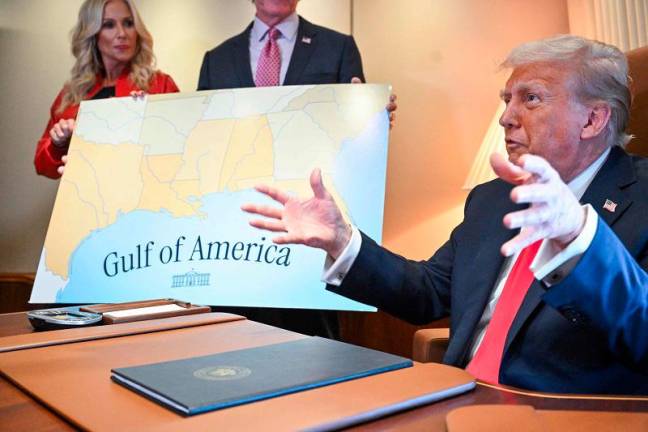 US President Donald Trump speaks to the press before signing a proclamation renaming the Gulf of Mexico as the Gulf of America aboard Air Force One, as it flies over the Gulf enroute to New Orleans, Louisiana on Febrary 09, 2025. For years, as disputes over names on the map riled up nationalist passions in several parts of the world, US policymakers have watched warily, trying to stay out or to quietly encourage peace. Suddenly, the United States has gone from a reluctant arbiter to a nomenclature belligerent, as President Donald Trump declared that the Gulf of Mexico will henceforth be called the “Gulf of America.” In an executive order signed hours after he returned to the White House, Trump called the water body an “indelible part of America” critical to US oil production and fishing and “a favorite destination for American tourism and recreation activities.” - ROBERTO SCHMIDT / AFP