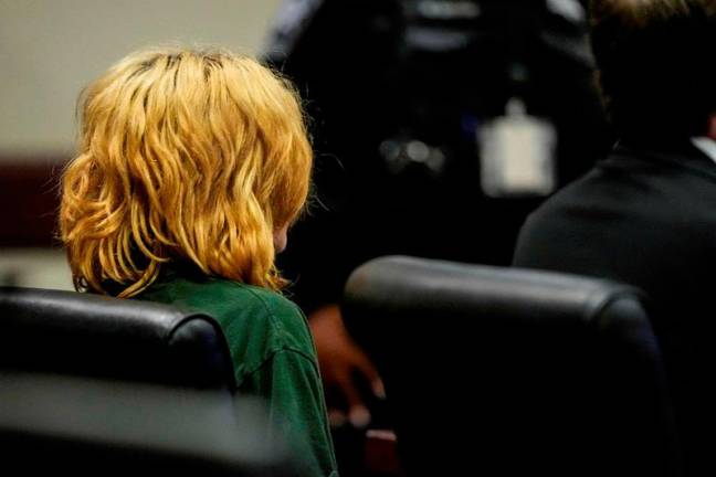 Colt Gray, who is charged as an adult with four counts of murder in the deaths of Mason Schermerhorn and Christian Angulo, both 14, Richard Aspinwall, 39, and Cristina Irimie, 53 sits in the Barrow County courthouse during his first appearence for the Wednesday shooting at Apalachee High School, in Winder, Georgia, U.S., September 6, 2024. - Brynn Anderson/Pool via REUTERS