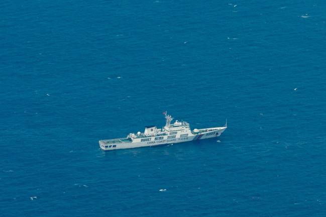 A Chinese Coast Guard vessel is pictured near the Philippine-occupied Thitu Island, in the disputed Spratly Islands, South China Sea, March 9, 2023. - REUTERS/Eloisa Lopez/File Photo