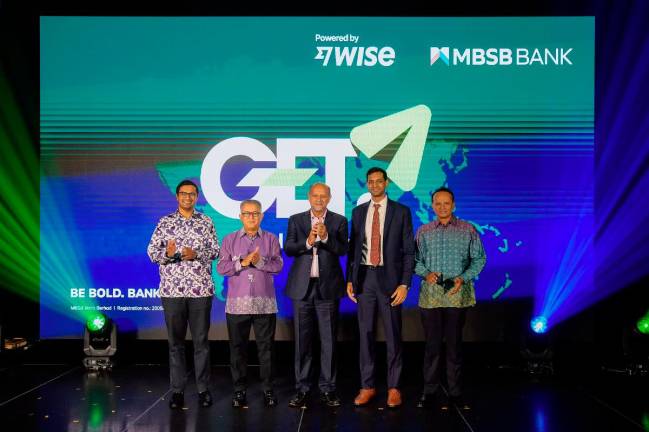 Digital Minister Gobind Singh Deo (centre) officiated the launch of GET - Global Easy Transfer, a first-in-Malaysia collaboration between MBSB Bank and WISE Platform, accompanied by (from left to right) Usman Ghouse, Group Chief Consumer Banking Officer of MBSB Bank, Datuk Wan Kamaruzaman Wan Ahmad, MBSB Berhad Chairman, Samarth Bansal, APAC General Manager at Wise Platform, and Rafe Haneef, Group Chief Executive Officer of MBSB Bank.