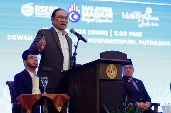 Prime Minister Datuk Seri Anwar Ibrahim speaking during the monthly meeting with the Prime Minister’s Department Staff in Puspanitapuri today. - Bernama pic