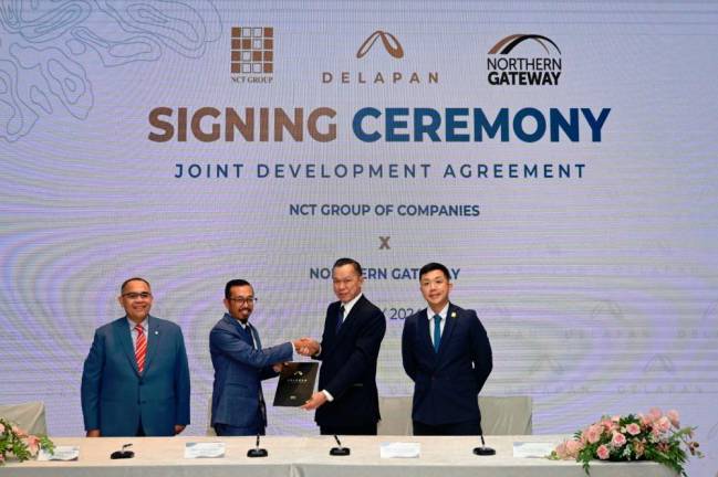 From left - Razwin Sulairee; Northern Gateway Board member Syaiful Hafiz Moamat Mastam; Yap, and NCT Group project director Yap Chun Theng at the signing ceremony.