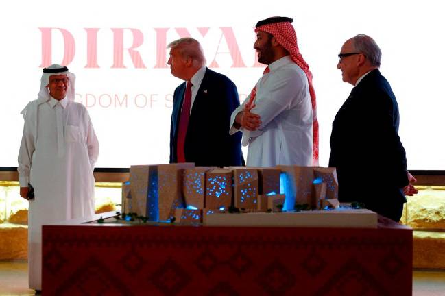 U.S. President Donald Trump and Saudi Crown Prince Mohammed Bin Salman stand during a visit to At-Turaif World Heritage Site, in Diriyah, Saudi Arabia, May 13, 2025. - REUTERS/Brian Snyder