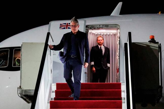 Britain’s Prime Minister Keir Starmer arrives in Egypt’s Red Sea resort town of Sharm Al-Sheikh on October 12, 2025, ahead of a world leaders’ summit on ending the Gaza war. British Prime Minister Keir Starmer will on Monday attend a Middle East peace summit for the signing ceremony of the Gaza deal, his office said, following a ceasefire between Israel and Hamas. - AFP