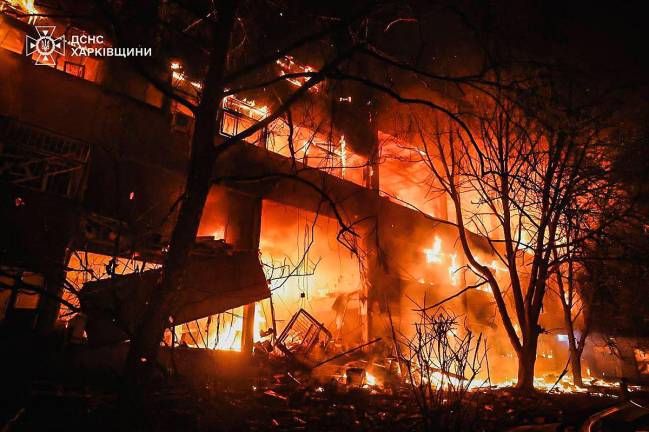 This handout photograph taken and released by the Ukrainian Emergency Service on June 11, 2025 shows a burning building following a drone attack in Kharkiv, amid the Russian invasion of Ukraine. - AFP PHOTO / UKRAINIAN EMERGENCY SERVICE