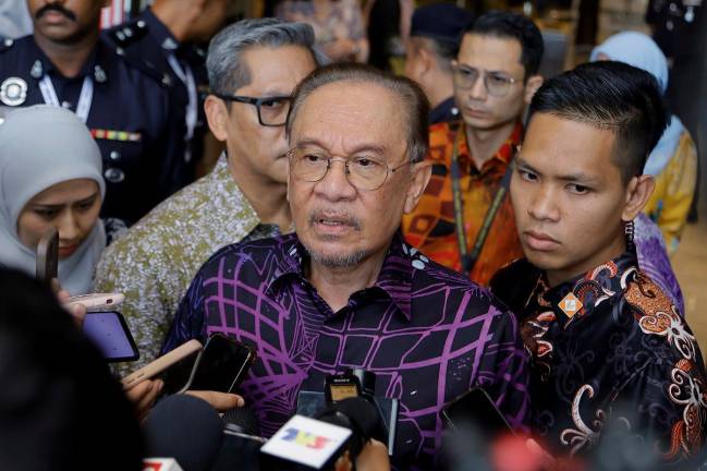 Anwar addressing the media after speaking during the Budget 2026 consultation session. - Bernama pic