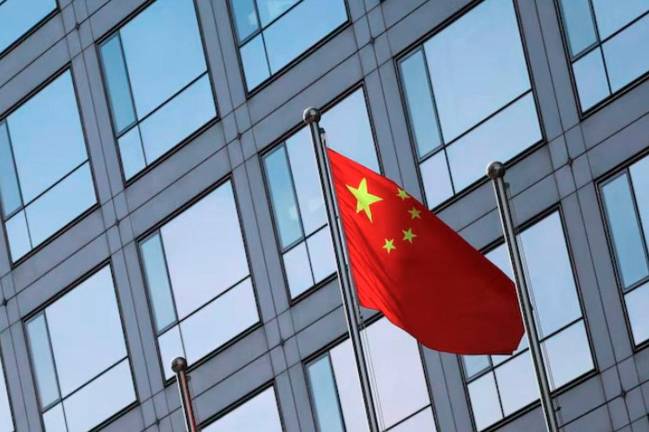 A Chinese flag flutters outside the China Securities Regulatory Commission (CSRC) building on the Financial Street in Beijing, China February 8, 2024. - REUTERSpix