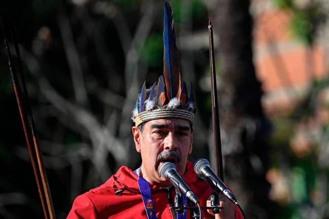 Venezuela’s President Nicolas Maduro speaks during a march to commemorate the “Day of Indigenous Resistance” in Caracas on October 12, 2025. - AFP